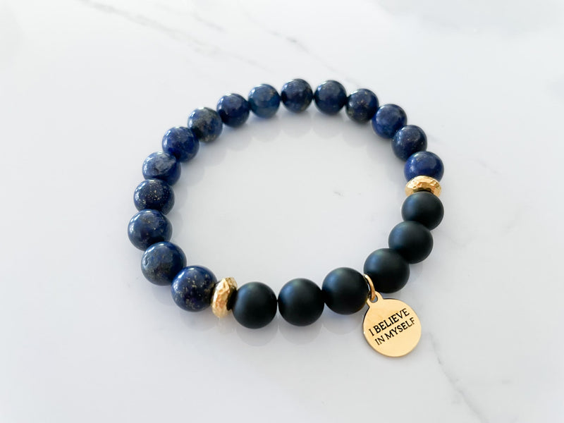 side view of the believe bracelet with lapis lazuli and onyx crystals and I believe in myself gold charm