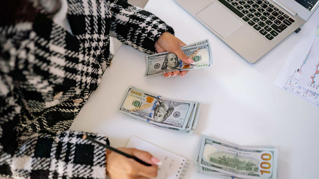 women counting money