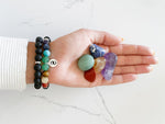 wearing the 7 chakra bracelet and holding crystals in hand