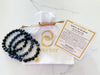 three piece believe bracelet set with reusable white velvet pouch and a bracelet card explaining the bracelet intention, affirmation, and gemstone properties. This bracelet is an inspirational bracelet for empowerment and daily motivation