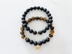 top view of a two piece brave bracelet with an onyx stack and gold I am brave charm for motivation and empowerment