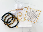 three piece brave bracelet set with reusable white velvet pouch and a bracelet card explaining the bracelet intention, affirmation, and gemstone properties. This bracelet is an inspirational bracelet for empowerment and daily motivation