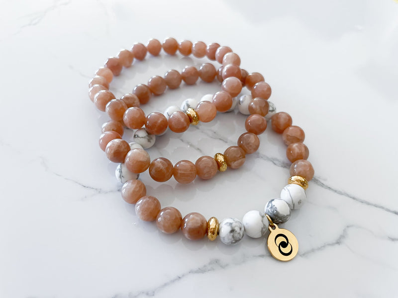 Three piece confidence bracelet with two additional peach moonstone bracelets